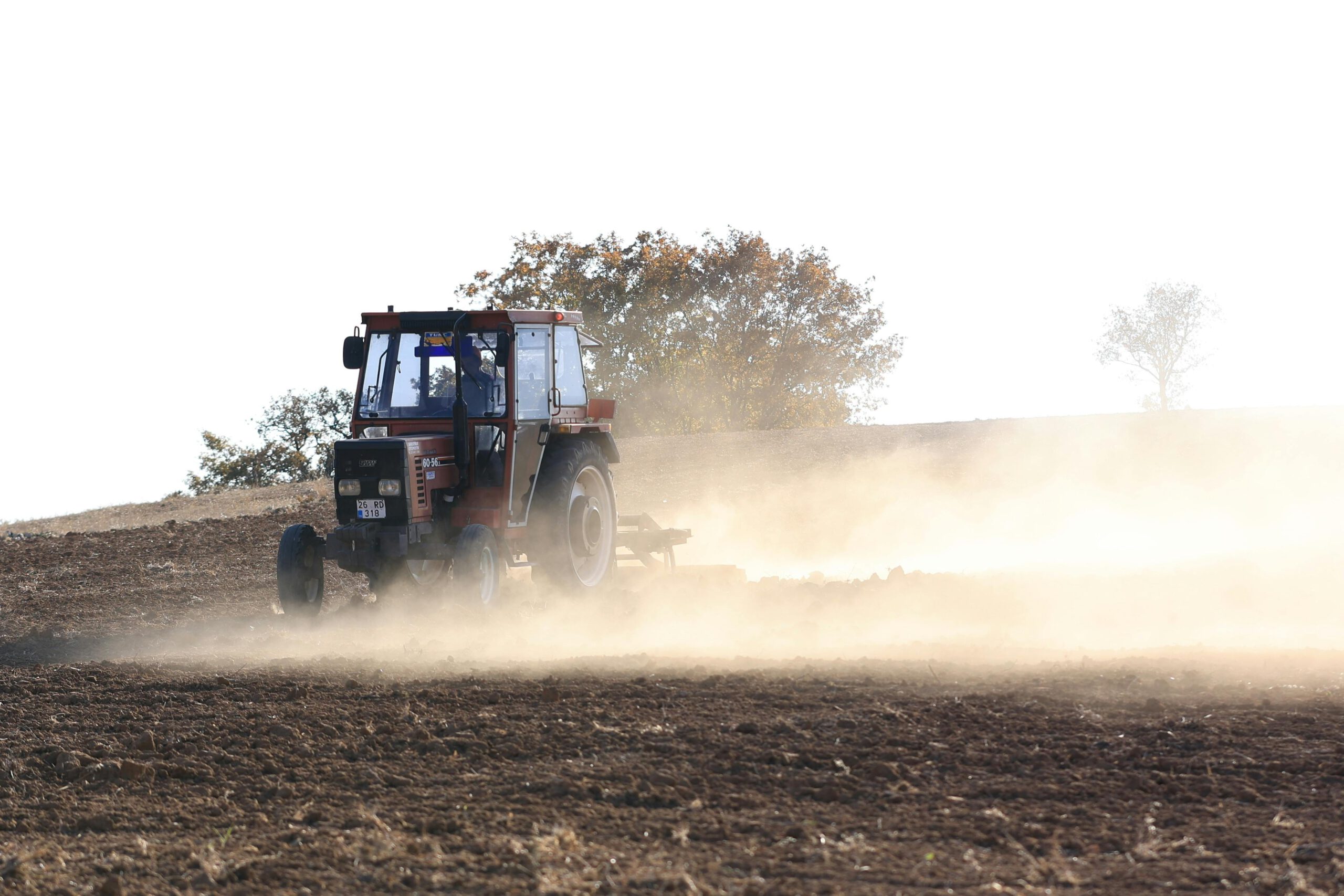 Photo by Aydın Photography: https://www.pexels.com/photo/farmer-plowing-field-with-tractor-on-dusty-day-29253996/